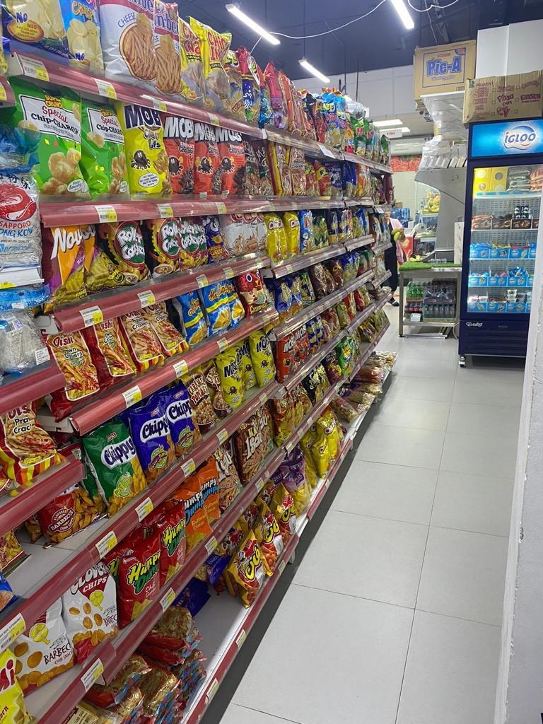 Snack and grocery shelves inside the supermarket