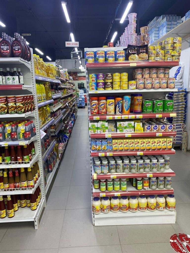 Grocery shelves with packaged food and cooking essentials